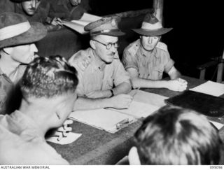 TOKO, BOUGAINVILLE. 1945-08-18. DURING AN INTERVIEW AT HEADQUARTERS 3 DIVISION, BRIGADIER A.R. GARRETT, BGS, HEADQUARTERS 2 CORPS (2), ASKS MAJOR OTSU, THE JAPANESE SURRENDER ENVOY, THE WHEREABOUTS ..