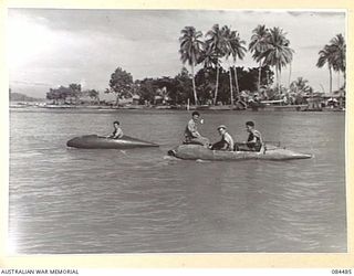 LABU, NEW GUINEA. 1944-12-18. 55 PORT CRAFT COY TROOPS IN DISCARDED AIRCRAFT BELLY TANKS ADAPTED WITH ENGINE, RUDDER AND KEEL FOR USE AS MOTOR BOATS. THE CRAFT ARE SPEEDY AND SURPRISINGLY ROOMY