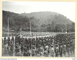 FINSCHHAFEN, NEW GUINEA, 1944-02-29. THE OFFICIAL OPENING OF THE FINSCHHAFEN WAR CEMETERY BY VX20308 MAJOR-GENERAL F.H. BERRYMAN, CBE, DSO, OFFICER COMMANDING 2ND AUSTRALIAN CORPS, WHO UNVEILED THE ..