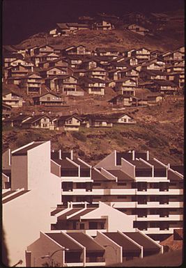 HAWAII-KAI, BUILT ON A SWAMP AND A HILLSIDE, IS A FAST-GROWING AREA EAST OF DOWNTOWN HONOLULU. SCARCITY OF LAND AND SKYROCKETING COSTS ARE FAVORING CONSTRUCTION OF TOWN HOUSES AND HIGH-RISE APARTMENTS OVER THE ONCE DOMINANT SINGLE-FAMILY UNITS