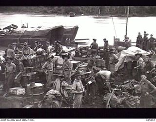 LANGEMAK AREA, NEW GUINEA. 1943-11-02. PERSONNEL OF THE 4TH AUSTRALIAN INFANTRY BRIGADE, THE 4TH AUSTRALIAN FIELD AMBULANCE AND THE 4TH AUSTRALIAN INFANTRY BRIGADE HEADQUARTERS SIGNALS ARRIVING AT ..