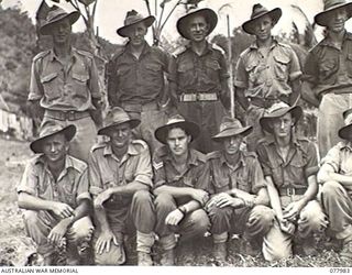 WUNUNG PLANTATION, NEW BRITAIN. 1944-12-30. THE COMMANDING OFFICER AND THE ADMINISTRATION STAFF OF THE 28TH MALARIA CONTROL UNIT ATTACHED TO HEADQUARTERS, 5TH DIVISION. FRONT ROW, LEFT TO RIGHT: ..