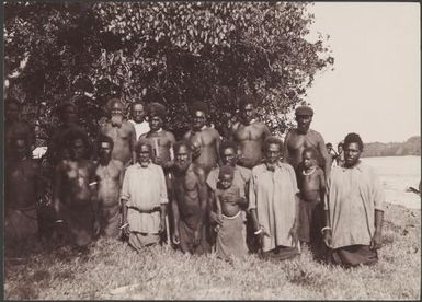 Ni-Vanuatu men and children at a Mota Lava beach, Banks Islands, 1906 / J.W. Beattie