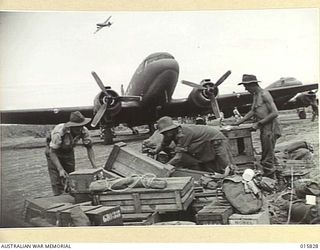 1943-09-25. NEW GUINEA. NADZAB AERODROME. TRANSPORTS BEING UNLOADED