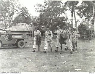 LAE, NEW GUINEA. 1944-09-03. THE GENERAL OFFICER COMMANDING, NEW GUINEA FORCE, VX13 LIEUTENANT-GENERAL S.G. SAVIGE, CB, CBE, DSO, MC, ED, (2) AND HIS STAFF OFFICERS ARRIVING AT HEADQUARTERS, NEW ..