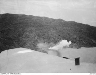 WEWAK AREA, NORTH EAST NEW GUINEA. C. 1944-10. AERIAL VIEW OF SMOKE BILLOWING FROM COASTLINE TARGETS IN THE WEWAK AREA SET ON FIRE IN AN AIR ATTACK BY AIRCRAFT OF NO. 8 (BEAUFORT) SQUADRON RAAF