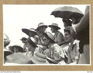 PORT MORESBY, NEW GUINEA. 1943-11-28. SERVICE WOMEN SPECTATORS AT THE ALLIED FORCES GRAND SWIMMING CARNVIAL