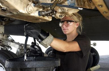 US Air Force (USAF) AIRMAN (AMN) Teal Kolawski, Aircraft Mechanic, performs maintenance on a USAF B-1B Lancer aircraft, on the flight line at Andersen Air Force Base (AFB), Guam, during Operation ENDURING FREEDOM