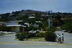 [View of people crossing street], Port Moresby, [Papua New Guinea, 1959?]