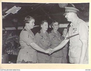 TOROKINA, BOUGAINVILLE. 1945-07-03. HIS ROYAL HIGHNESS, THE DUKE OF GLOUCESTER, GOVERNOR-GENERAL OF AUSTRALIA (5), BEING INTRODUCED TO MEMBERS OF THE AUSTRALIAN ARMY NURSING SERVICE DURING HIS ..