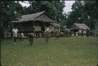 Brian McBarron (Agricultural Officer) dispensing yams after drought (2) : Goodenough Island, D'Entrecasteaux Islands, Papua New Guinea, 1956-1958 / Terence and Margaret Spencer