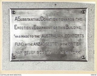 LAE, NEW GUINEA. 1945-11-02. THE PLAQUE FROM THE OTHER RANKS' CLUB, FIRST ARMY, AT PORT MORESBY, WHICH WAS SENT TO LAE TO BE PHOTOGRAPHED