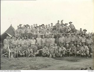 HOLLANDIA, DUTCH NEW GUINEA. 1944-06-03. GROUP PORTRAIT OF THE SERVICING AND OPERATIONS STAFF OF NO. 78 (KITTYHAWK) SQUADRON RAAF WHICH WON THE BIGGEST AIR BATTLE SINCE MILNE BAY WHEN PILOTS ..