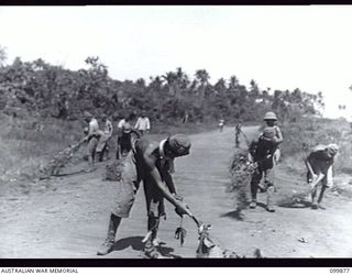 RABAUL, NEW BRITAIN, 1946-03-01. AFTER A LONG PERIOD OF HEAT, SELF COMBUSTION OF CORDITE CAUSED A FIRE IN 5,500 TONS OF JAPANESE AMMUNITION AWAITING DUMPING OFF RABAUL. ALL THE AMMUNITION WAS ..