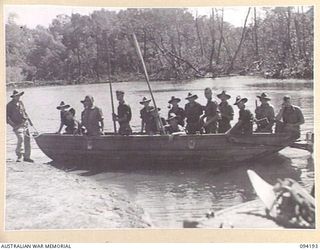WEWAK AREA, NEW GUINEA. 1945-07-18. MEMBERS OF A JUNGLE PATROL FROM B COMPANY, 2/1 INFANTRY BATTALION ARRIVING AT THE BEACH CAMP FROM YARABOS FOR A FEW DAYS WELL-EARNED REST