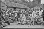 Government-sponsored festival in Tabibuga: teacher Peter Stubbs, Nancy Cook, and patrol officer John (Jack) Edwards (l to r) with luluais and other people