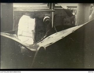 MILNE BAY. C.1943-04-14. DAMAGE CAUSED BY A BOMB WHICH PENETRATED THE BRIDGE STRUCTURE OF HMAS PIRIE BEFORE EXPLODING ON THE FORECASTLE. THE BOMB WAS DROPPED BY A JAPANESE AIRCRAFT WHEN THE ..