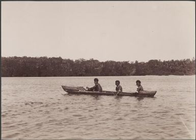 Three men of Port Adam in a canoe, Malaita, Solomon Islands, 1906 / J.W. Beattie