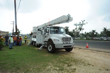 The Commonwealth Utility Corporation and Colorado Primary Source Electric crews repair power lines on the island of Saipan as part of the effort to restore long term power to the area after Typhoon Soudelor caused devastation in August.