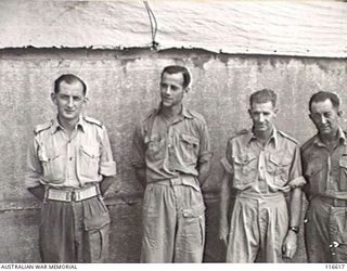 LAE, NEW GUINEA. 1945. MEMBERS OF THE STAFF OF RADIO LAE, A 50-KILOWATT RADIO TRANSMITTER WHICH WAS MADE FROM SALVAGED ALLIED AND ENEMY WIRELESS PARTS. IDENTIFIED PERSONNEL ARE: SERGEANT (SGT) J. ..