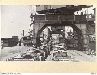 TOWNSVILLE, QLD. 1944-10-18. JEEPS OF FIRST ARMY AT THE MARSHALLING YARD AWAITING EMBARKATION TO NEW GUINEA ABOARD THE LIBERTY SHIP SS JAMES OLIVER