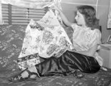 Maurita Meyer, night club dancer returns from USO trip to Japan, Korea and Hawaii, with silk kimono, Bloomington, IL, 1946