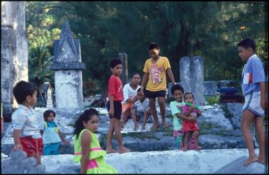 Group of children in Avarua church graveyard, Rarotonga