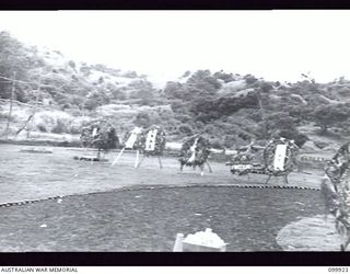 RABAUL, NEW BRITAIN, 1946-03-16. OF THE 653 CHINESE WHO DIED WHILST CAPTIVES OF THE JAPANESE, 259 WERE RE-INTERRED IN A CHINESE CEMETERY AT RABAUL. THE NEAT GROUNDS, ROWS OF MARKED GRAVES AND AN ..