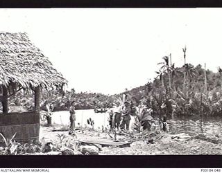 NEW GUINEA. 1945. MEMBERS OF THE AUSTRALIAN ARMY NURSING SERVICE, 2/11 AUSTRALIAN GENERAL HOSPITAL, OUTSIDE THE MESS HUT. FROM LEFT TO RIGHT: SISTERS HARRIS; FORDMAN; BANKS