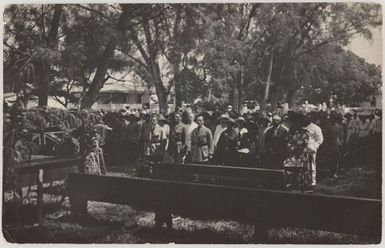 People standing at a formal ceremony