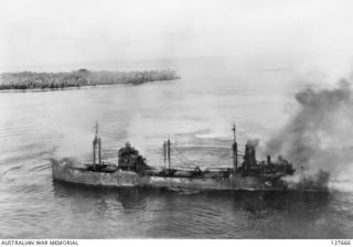 KAVIENG, NEW IRELAND. ? 1944-03. A JAPANESE SHIP UNDER ATTACK BY B25 MITCHELL BOMBERS FROM FIFTH AIR FORCE, UNITED STATES ARMY AIR FORCE. BOMBS FROM THE AIRCRAFT HAVE STRUCK THE SHIP BUT HAVE NOT ..