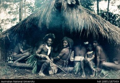 People sitting in hut