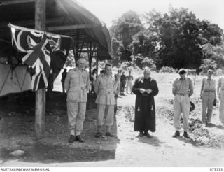 LAE, NEW GUINEA. 1944-08-13. VX93179 CHAPLAIN W.S. DAU, DEAN OF BENDIGO, VICTORIA (3) PRAYING DURING THE OFFICIAL OPENING CEREMONY OF THE CORPORAL RONALD RILEY, MEMORIAL GROUND AFTER DX858 ..