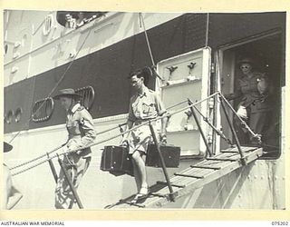 LAE, NEW GUINEA. 1944-08-14. SISTERS FROM THE 128TH GENERAL HOSPITAL, PORT MORESBY, DISEMBARKING FROM THE 2/1ST HOSPITAL SHIP MANUNDA. IDENTIFIED PERSONNEL ARE:- NFX125961 SISTER E.S. BRENNAN (3); ..