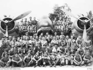 Group portrait of unidentified ground crew members of No. 30 Beaufighter Squadron RAAF at Tadji airstrip