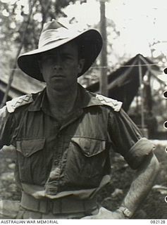 New Guinea. 1944-10-27. Portrait of war artist SX7174 Captain Ivor Hele with tent lines in the background