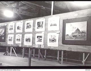 TOROKINA, BOUGAINVILLE, 1945-12-07. SOME OF THE NUMEROUS ENTRIES IN THE ART SECTION AT THE ARTS AND CRAFTS EXHIBITION HELD AT TOROKINA. MANY OF THE ENTRANTS ARE STUDENTS AT THE TOROKINA ..