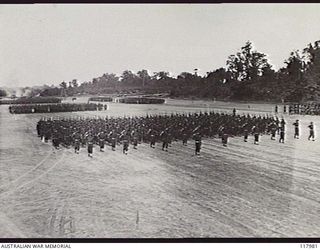 TOROKINA, BOUGAINVILLE. 1945-10-29. PERSONNEL OF 42ND INFANTRY BATTALION GIVE EYES RIGHT TO THE COMMANDER IN CHIEF, AUSTRALIAN MILITARY FORCES, DURING THE MARCH PAST OF 3RD DIVISION ON THE PIVA ..
