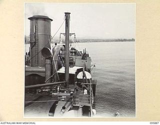 WEWAK HARBOUR, NEW GUINEA. 1945-09-03. LOOKING TOWARDS THE STERN OF THE TROOPSHIP, SS RIVER FITZROY. THE VESSEL HAS A TROOP CARRYING CAPACITY OF 500