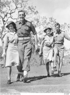 1943-07-26. NEW GUINEA. THE FINISH OF A THREE-LEGGED RACE AT A SPORTS MEETING ORGANISED IN NEW GUINEA BY AN AUSTRALIAN ARTILLERY UNIT. SGT. ERNEST KEENE, OF MORRESET, N.S.W. WITH SISTER BARBARA ..