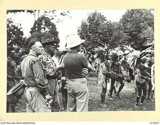 HIGITURA, NEW GUINEA. 1944-04-27. THE HONOURABLE E.J. WARD, MINISTER FOR EXTERNAL TERRITORIES IN THE AUSTRALIAN GOVERNMENT (1), WITH NX191031 LIEUTENANT-COLONEL A.A. CONLON, DIRECTORATE OF ARMY ..