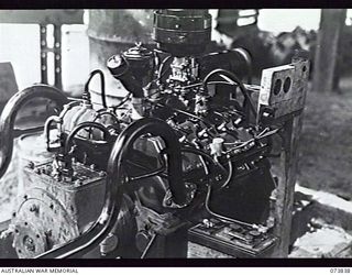 LABU, NEW GUINEA. 1944-06-17. A FORD ENGINE AND MARINE GEAR BOX FOR SMALL CRAFT. THE ARRANGEMENT WAS ASSEMBLED BY MEMBERS OF THE 1ST WATERCRAFT WORKSHOP, AUSTRALIAN ELECTRICAL AND MECHANICAL ..