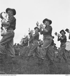 HERBERTON RACECOURSE, WONDECLA, ATHERTON TABLELAND, QLD. 1945-01-19. THE 2/28TH INFANTRY BATTALION BAND COMPETING IN THE BAND CONTEST DURING THE 9 DIVISION GYMKHANA