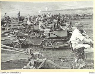 1943-09-25. NEW GUINEA. ADVANCE ON LAE. BULLDOZERS PLAYED A GREAT PART IN FORMING ROADS THROUGH THE JUNGLE TO ENABLE ARTILLERY TO BE BROUGHT UP FOR THE FINAL ASSAULT ON LAE