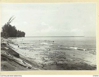 MOTUPINA POINT AREA, BOUGAINVILLE ISLAND. 1945-01-20. LOOKING ALONG THE BEACH TOWARDS THE JAPANESE HELD MOTUPINA POINT FROM THE FLASH SPOTTER'S POSITION AT NO.5 BATTERY, 2ND FIELD REGIMENT