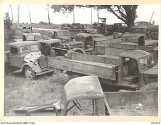 KAHILI, BOUGAINVILLE. 1945-10-05. JAPANESE 3-TON TRUCKS PLACED IN THE VEHICLE POOL AT HEADQUARTERS 2 CORPS BEFORE THEIR EVACUATION TO FAURO ISLANDS. ALTHOUGH THE TRUCKS WERE IN RUNNING ORDER THEY ..