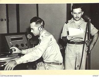 PORT MORESBY, PAPUA, 1944-02. UNIT "9PA" BROADCASTING STATION, CONTROLLED BY THE AUSTRALIAN BROADCASTING COMMISSION, AND THE AMERICAN ARMED FORCES RADIO, IS A POPULAR AMENITY RECENTLY INSTALLED. ..