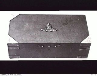 MELBOURNE, VIC. 1945-07-17. THE OUTSIDE OF A CIGARETTE BOX WITH SOLID SILVER FITTINGS AND AN ARTILLERY COAT OF ARMS ON THE LID. THE BOX WAS PRESENTED TO OFFICERS OF THE 4TH REGIMENT OF HEAVY ..