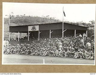 DONADABU, PAPUA, NEW GUINEA. 1944-01-01. SPECTATORS IN AND AROUND THE GRANDSTAND DURING THE 15TH INFANTRY BRIGADE GYMKHANA