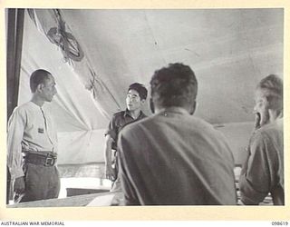 CAPE WOM, NEW GUINEA. 1945-10-19. LIEUTENANT MATSUBA OF THE JAPANESE ARMY, BEING INTERROGATED AT HEADQUARTERS 6 DIVISION BY THE WEWAK WAR CRIMES COMMISSION. LIEUTENANT MATSUBA IS BEING HELD ON ..
